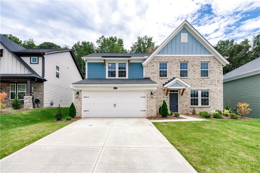 Front exterior of a new home in The Reserve At Liberty Park, Braselton, GA, highlighting curb appeal (Image 15).