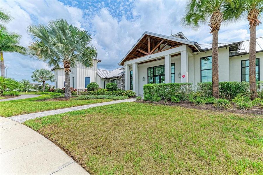 Front exterior of a new home in , Lakewood Ranch, FL, highlighting curb appeal (Image 20).