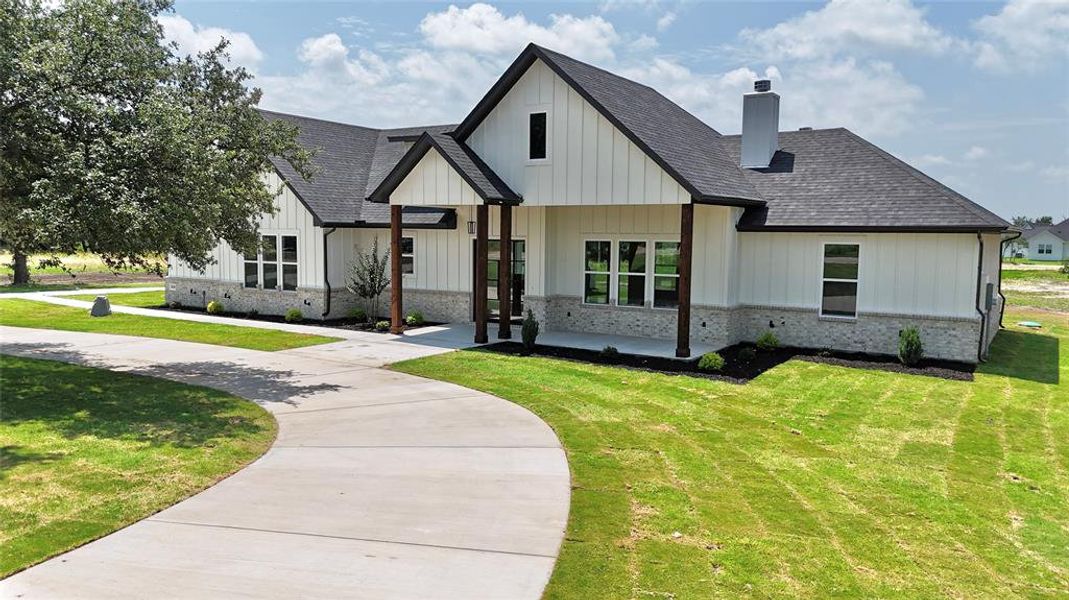 Front exterior of a new home in , Weatherford, TX, highlighting curb appeal (Image 33).