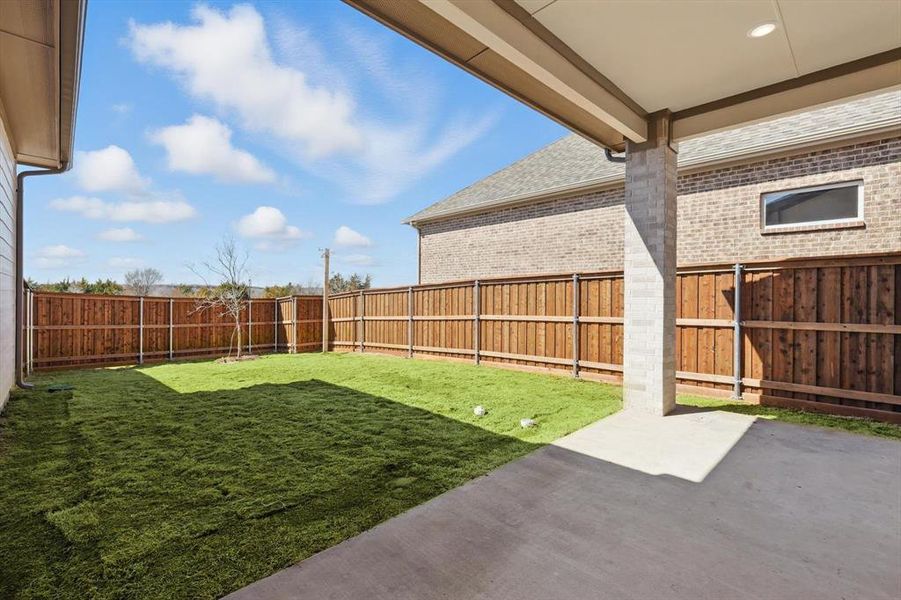 View of yard with a patio area and a fenced backyard