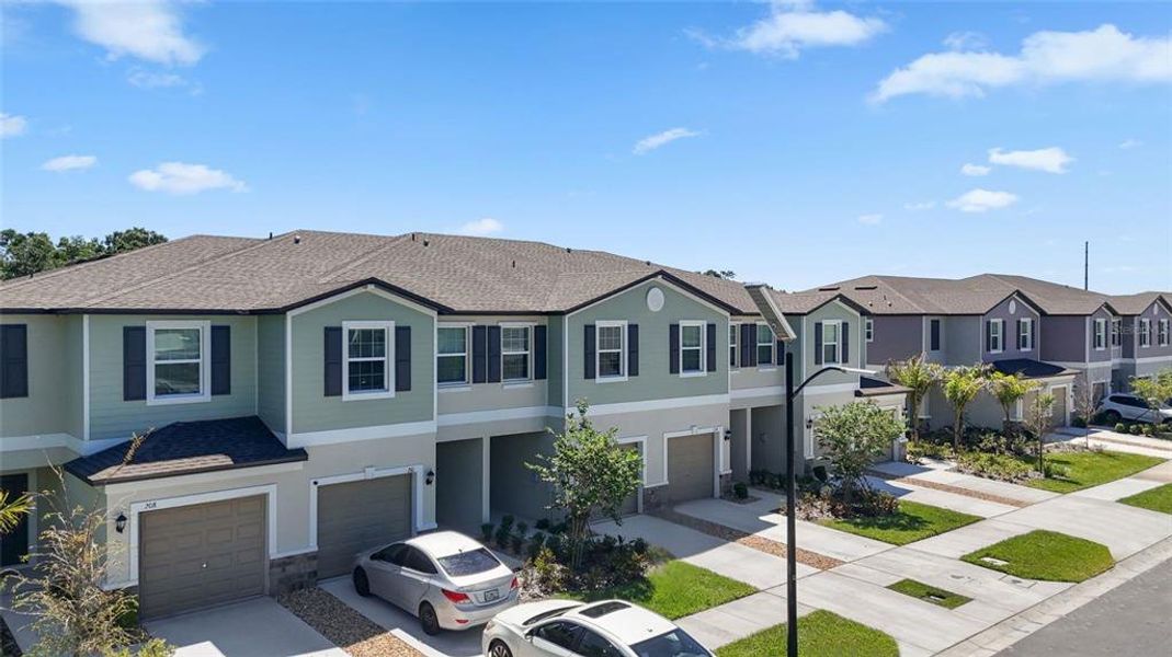 Front exterior of a new home in , Ruskin, FL, highlighting curb appeal (Image 28).