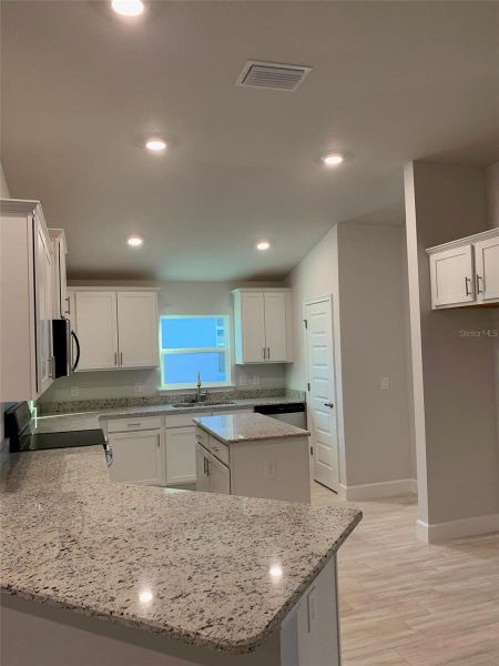 Furnished interior view inside a new home in Twisted Oaks, Beverly Hills (Image 3).