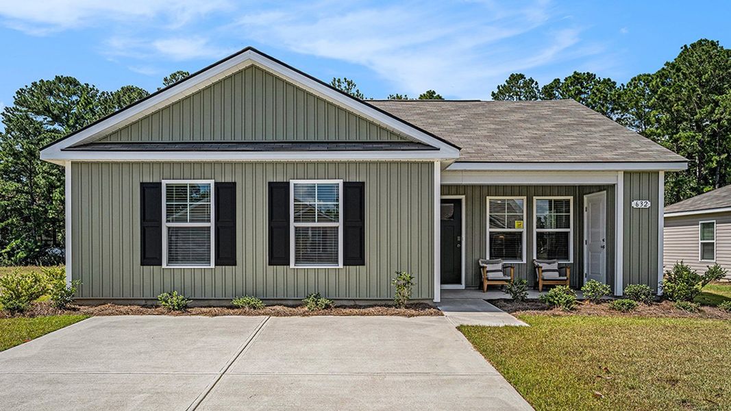 Front exterior of a new home in Sandpiper Place, Myrtle Beach, SC, highlighting curb appeal (Image 1). Front exterior of a new home in Sandpiper Place, Myrtle Beach, SC, highlighting curb appeal (Image 1).