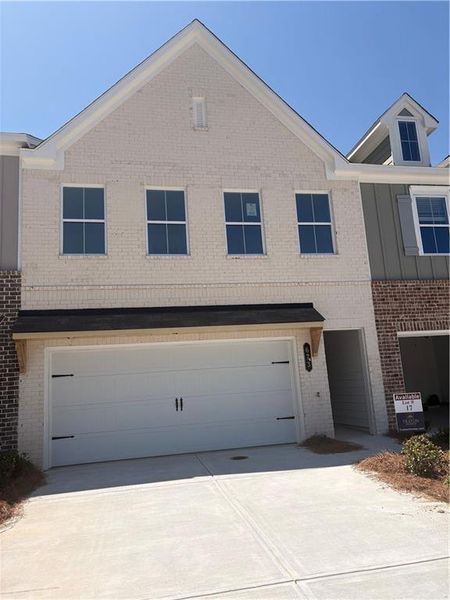 Front exterior of a new home in River Walk Place, Lawrenceville, GA, highlighting curb appeal (Image 18). Front exterior of a new home in River Walk Place, Lawrenceville, GA, highlighting curb appeal (Image 18).