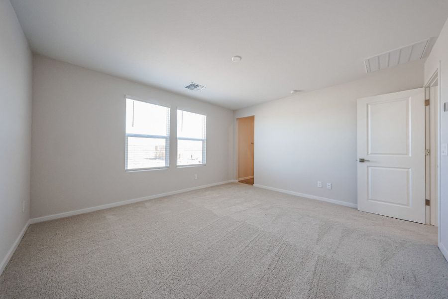 A room with white walls and a window. A room with white walls and a window.