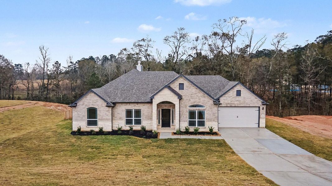 Front exterior of a new home in Rose Hill Estates, Willis, TX, highlighting curb appeal (Image 16).