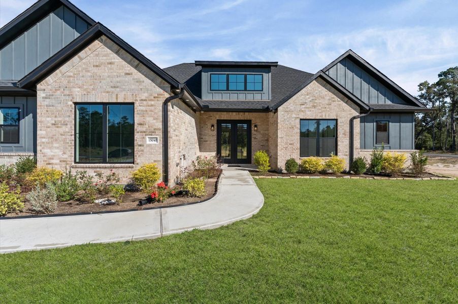 Front exterior of a new home in , Conroe, TX, highlighting curb appeal (Image 26).