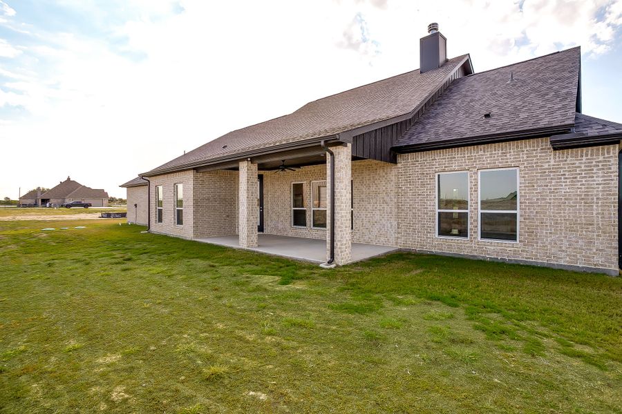 Front exterior of a new home in Rocky Top Ranch, Reno, TX, highlighting curb appeal (Image 31). Front exterior of a new home in Rocky Top Ranch, Reno, TX, highlighting curb appeal (Image 31).