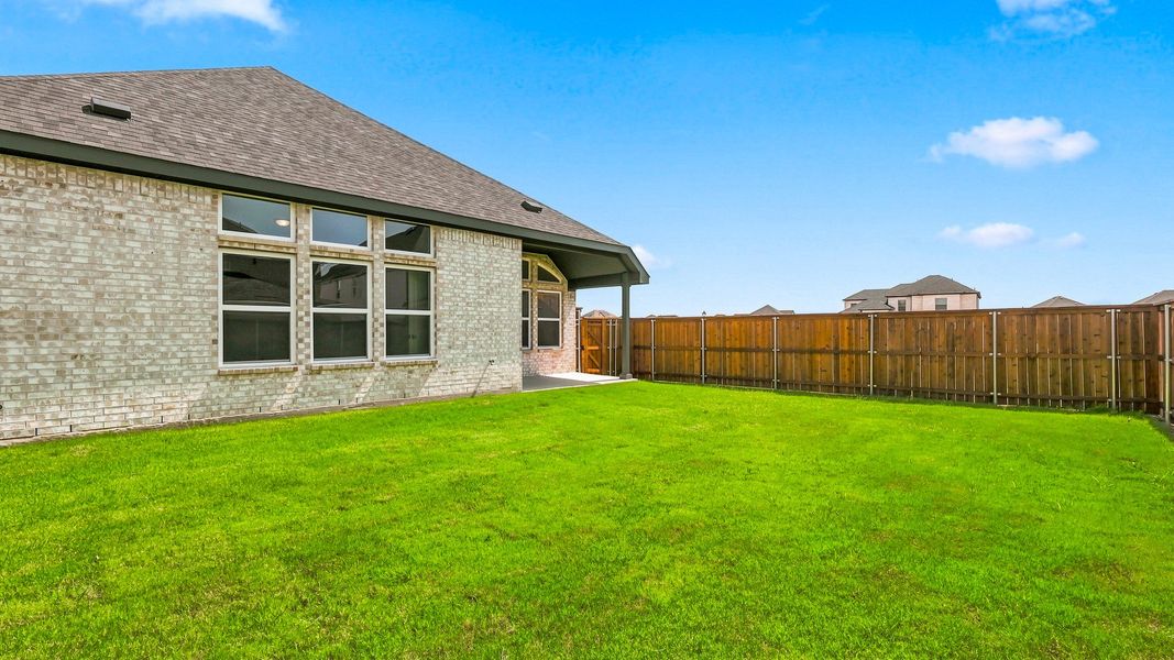 Exterior details and patio area of a home in Green Meadows Premier, Celina (Image 22).