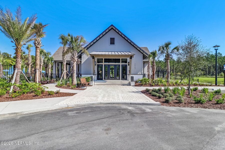 Front exterior of a new home in Tributary, Yulee, FL, highlighting curb appeal (Image 24).