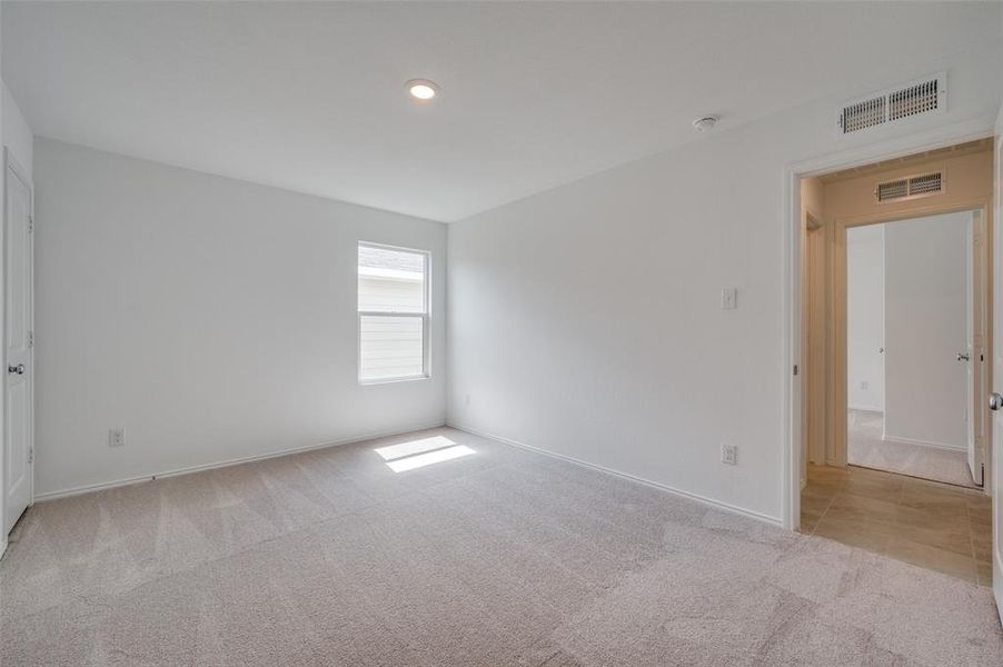 Empty room featuring light colored carpet Empty room featuring light colored carpet