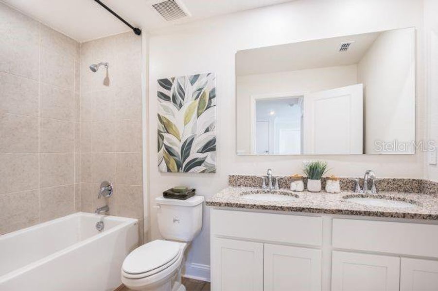 Furnished interior view inside a new home in Lake Deer Estates, Poinciana (Image 10).