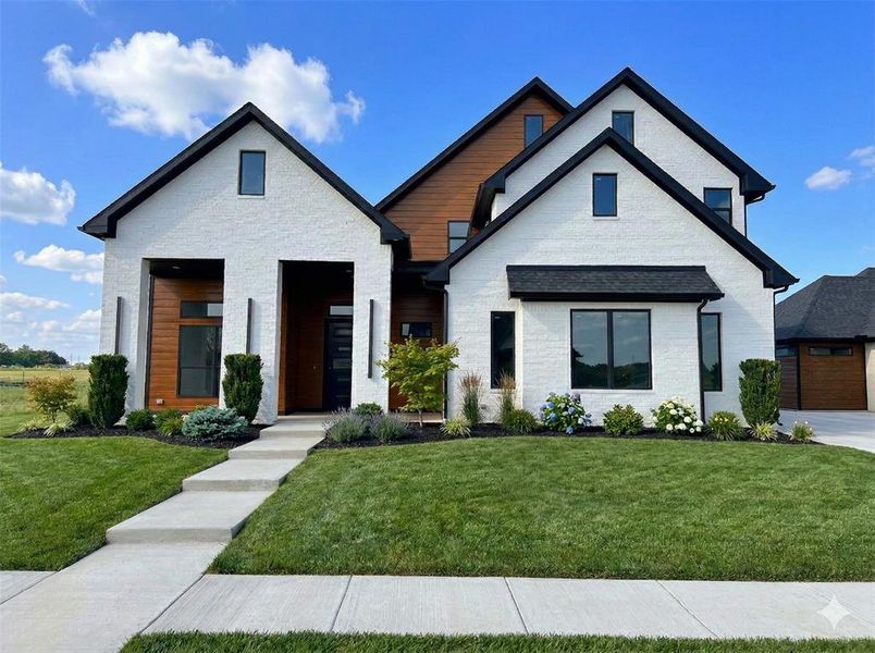Front exterior of a new home in , Pottsboro, TX, highlighting curb appeal (Image 2). Front exterior of a new home in , Pottsboro, TX, highlighting curb appeal (Image 2).