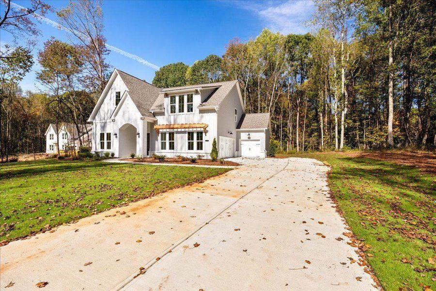Front exterior of a new home in , Gainesville, GA, highlighting curb appeal (Image 2).