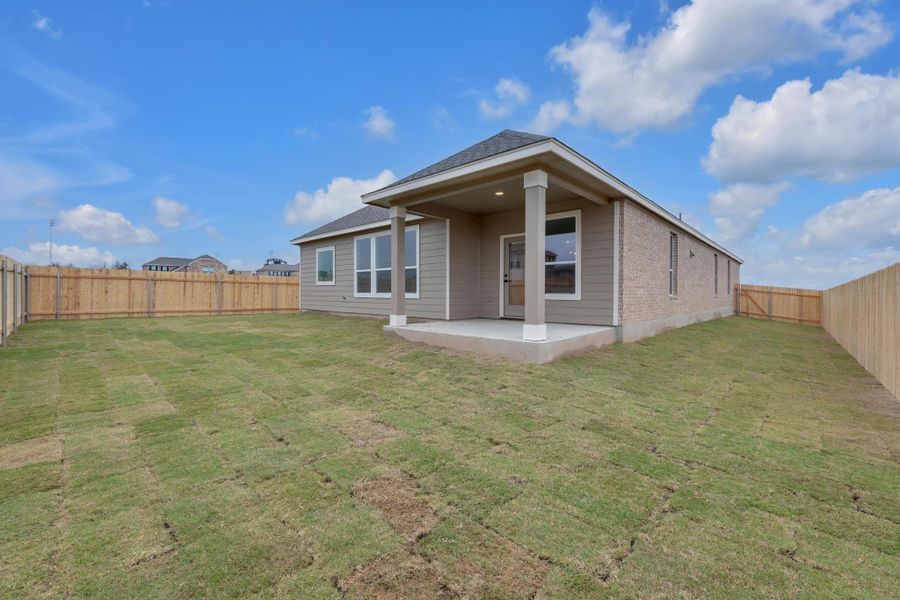 Exterior details and patio area of a home in Mustang Valley, Manor (Image 4).