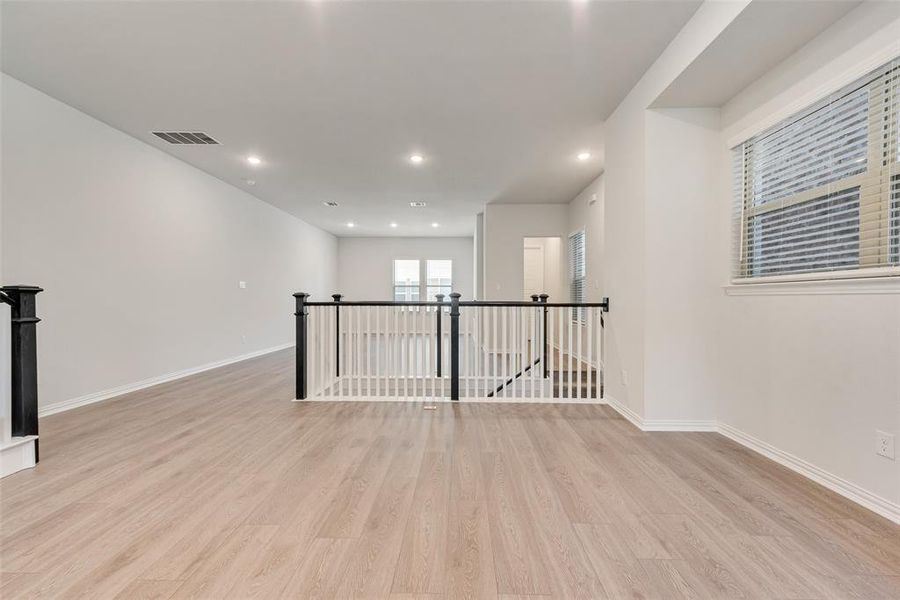 Unfurnished room featuring light wood-type flooring