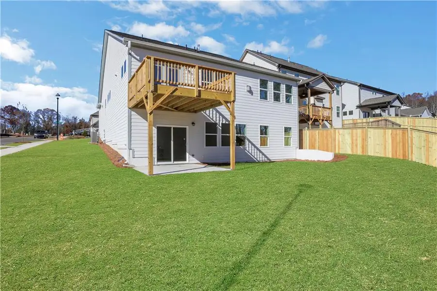 Exterior details and patio area of a home in Marble Tree, Ball Ground (Image 3).
