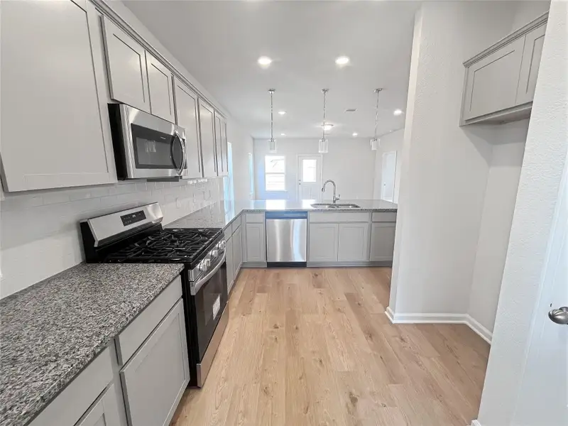 The Caldwell- Kitchen. Sample image for illustration; upgrades, options, and colors may vary.