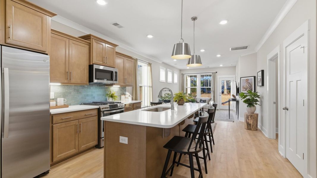 Memorable meals begin in this vibrant kitchen with pendant lighting and a thoughtfully designed island in Greenville, SC