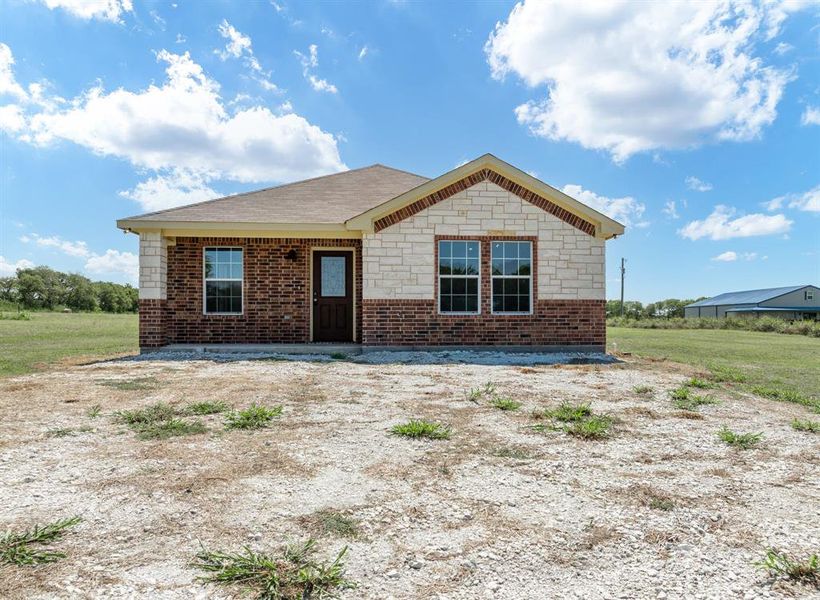 Front exterior of a new home in , Itasca, TX, highlighting curb appeal (Image 14). Front exterior of a new home in , Itasca, TX, highlighting curb appeal (Image 14).