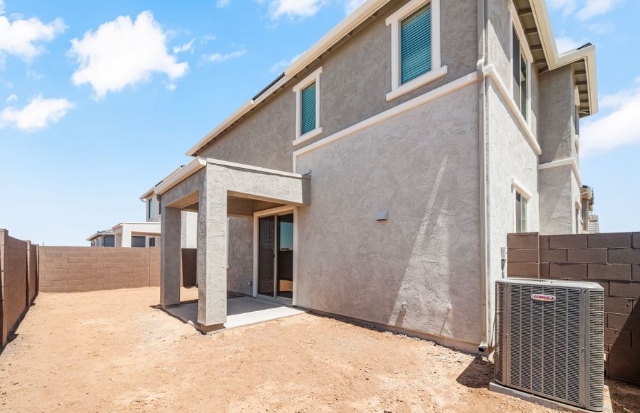 Exterior details and patio area of a home in Asante- Atrium Series, Surprise (Image 3).