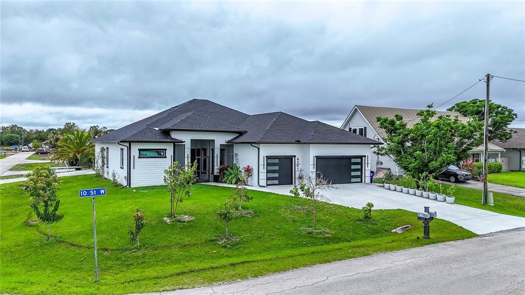 Front exterior of a new home in , Lehigh Acres, FL, highlighting curb appeal (Image 26).