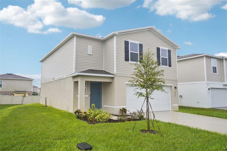 Front exterior of a new home in Scenic Terrace, Haines City, FL, highlighting curb appeal (Image 1). Front exterior of a new home in Scenic Terrace, Haines City, FL, highlighting curb appeal (Image 1).