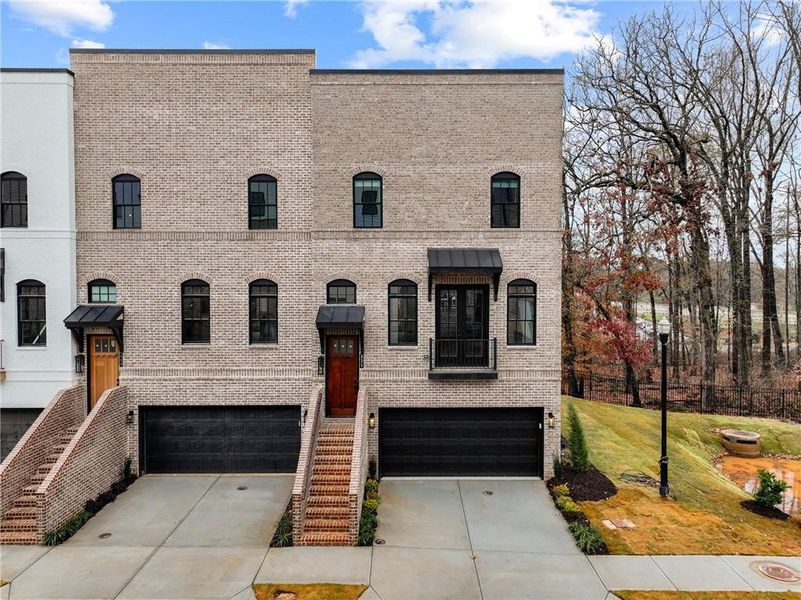 Front exterior of a new home in , Sugar Hill, GA, highlighting curb appeal (Image 1).
