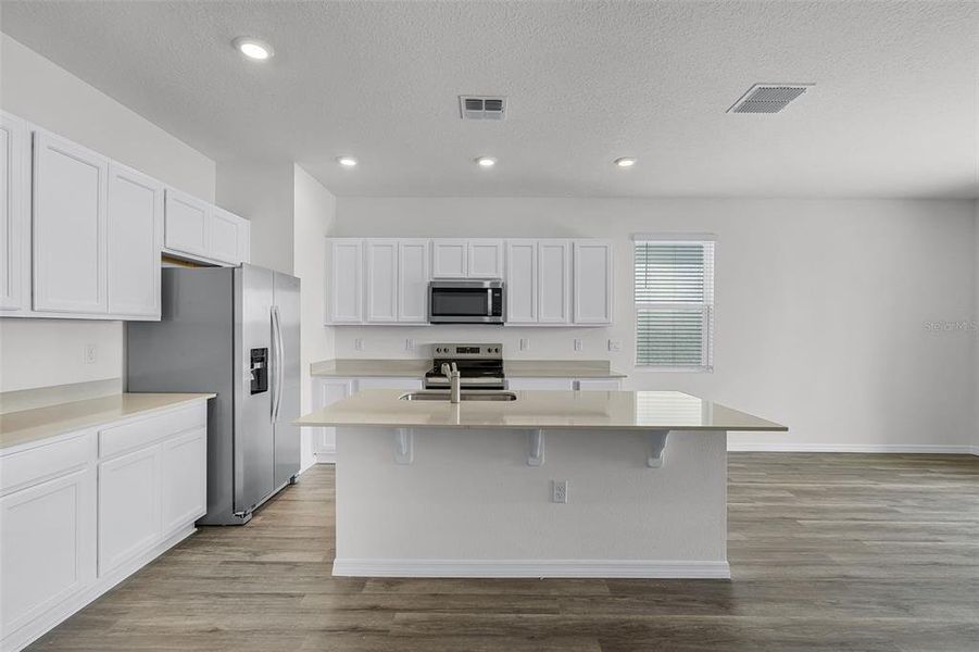 Furnished interior view inside a new home in , Winter Haven (Image 7). Furnished interior view inside a new home in , Winter Haven (Image 7).