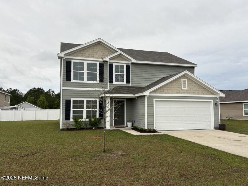 Front exterior of a new home in , Macclenny, FL, highlighting curb appeal (Image 2). Front exterior of a new home in , Macclenny, FL, highlighting curb appeal (Image 2).