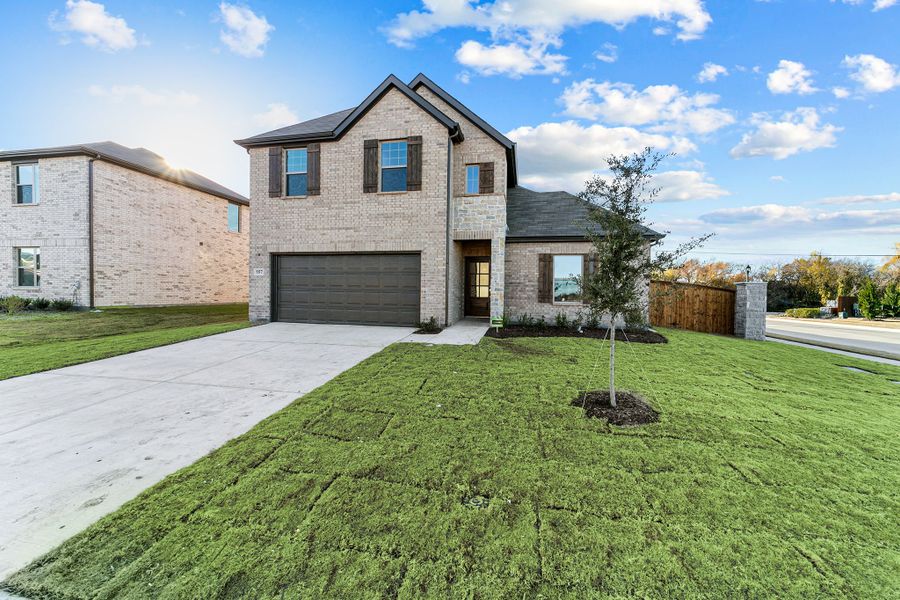 Front exterior of a new home in Rolling Ridge, Van Alstyne, TX, highlighting curb appeal (Image 1). Front exterior of a new home in Rolling Ridge, Van Alstyne, TX, highlighting curb appeal (Image 1).