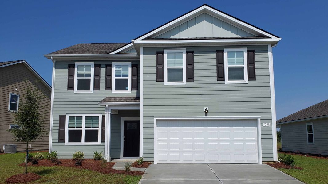 Front exterior of a new home in Kingston Bay, Conway, SC, highlighting curb appeal (Image 1).