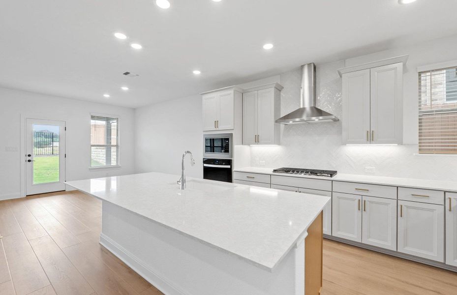 Furnished interior view inside a new home in West Cypress Hills, Spicewood (Image 3).