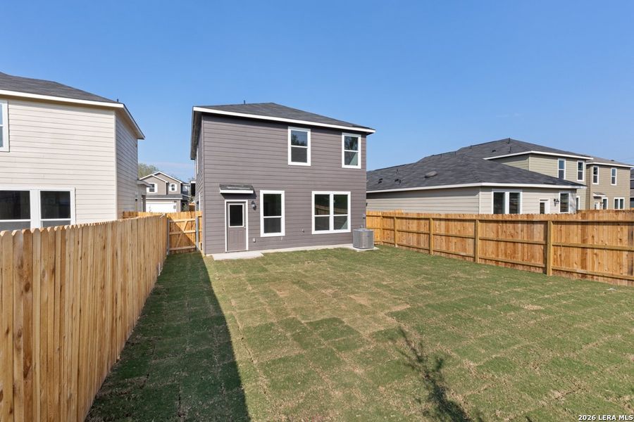 Exterior details and patio area of a home in Spanish Trails Villas, San Antonio (Image 4).