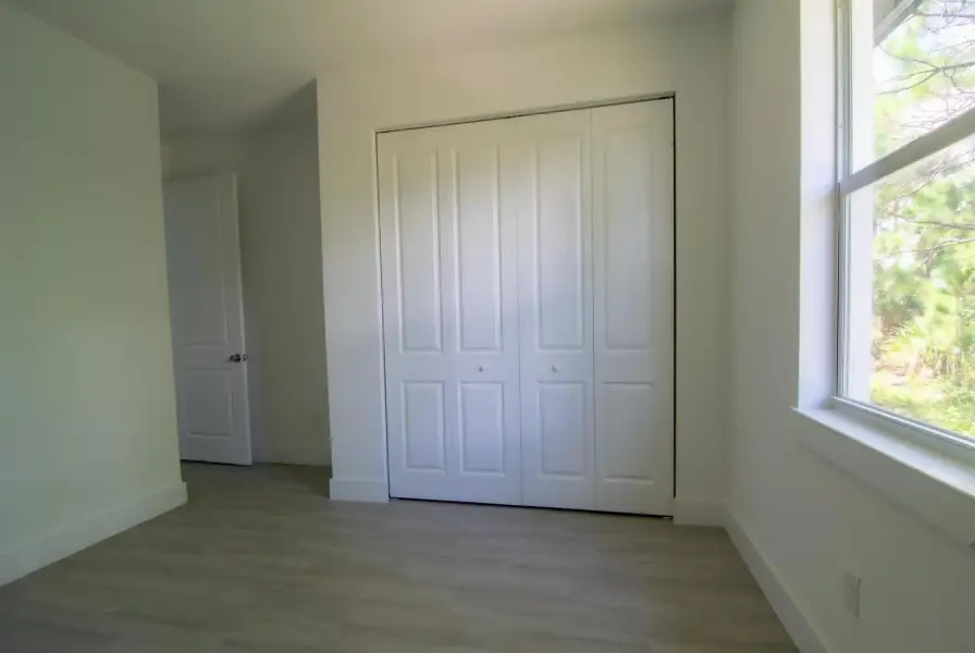 Bright Bedroom with Closet