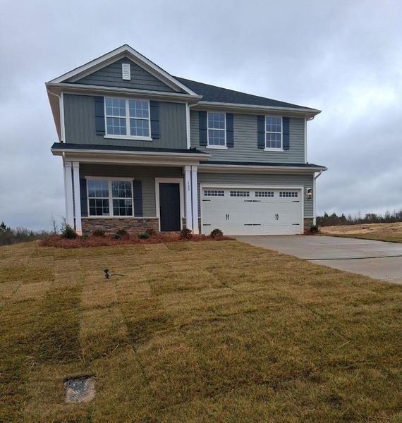 Front exterior of a new home in Northlake, Statesville, NC, highlighting curb appeal (Image 1). Front exterior of a new home in Northlake, Statesville, NC, highlighting curb appeal (Image 1).