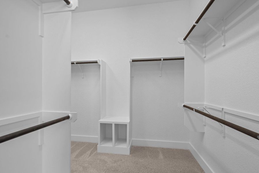 Walk-in closet in Primary Bedroom Walk-in closet in Primary Bedroom