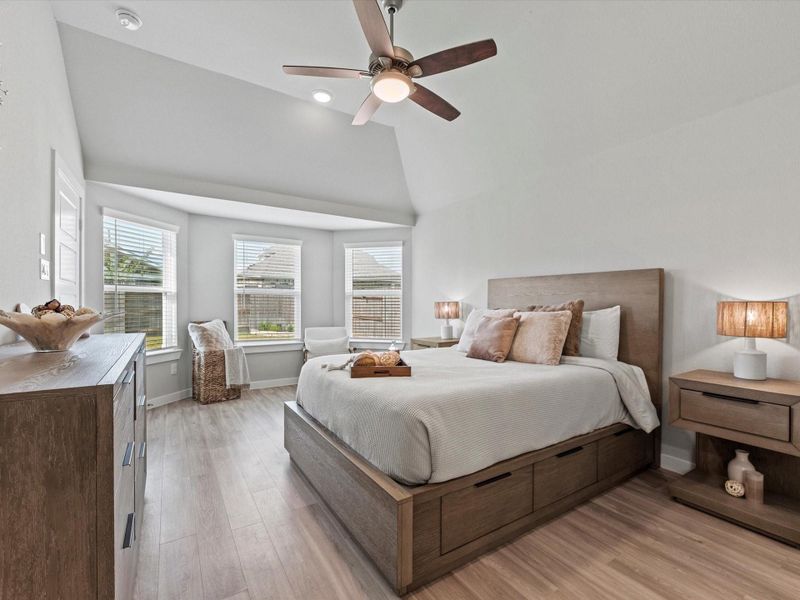 Primary suite entry with views of the bay window sitting area.