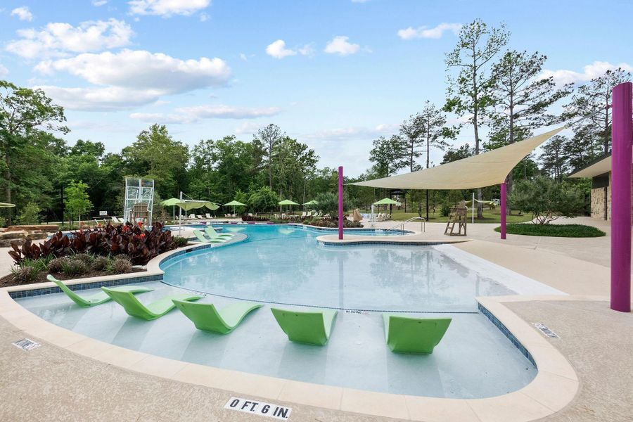 Take advantage of the resort-style community pool, featuring a beach-entry shallow end with built-in loungers for the ultimate relaxation. The beautifully maintained facility includes ample sunshade and lush landscaping, offering a vacation-like atmosphere just steps from home.