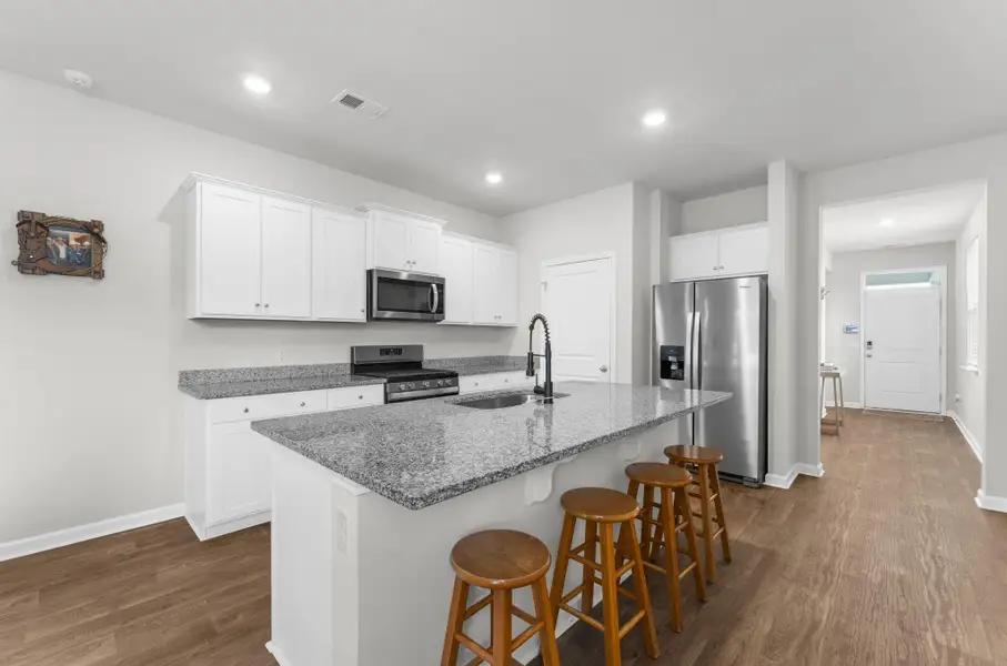 Furnished interior view inside a new home in Pine Hills at Cane Bay, Summerville (Image 15).