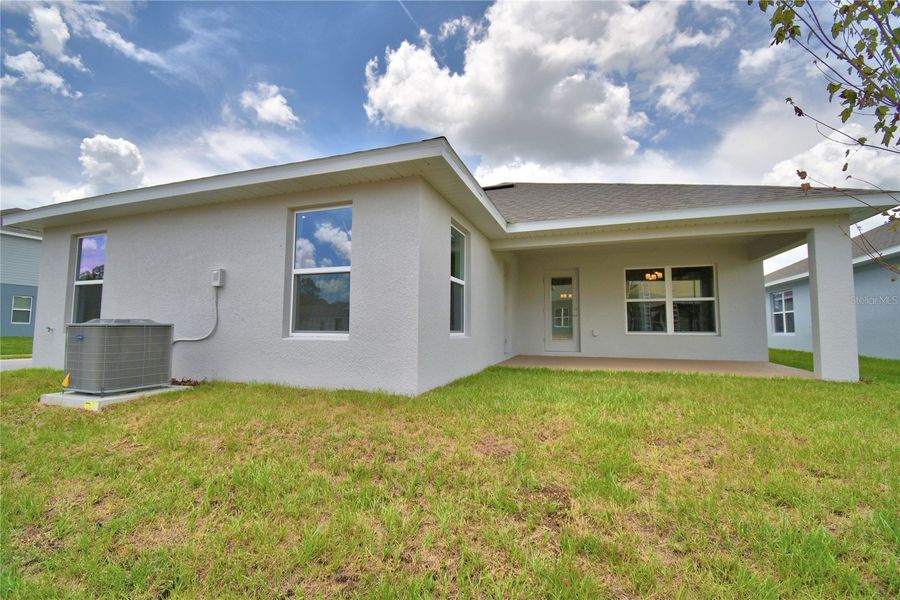 Exterior details and patio area of a home in Cadence Crossing, Auburndale (Image 3).