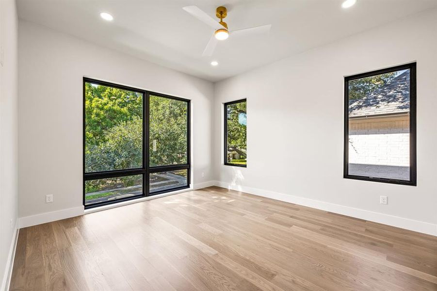 Unfurnished room featuring light wood-style floors, recessed lighting, and a ceiling fan Unfurnished room featuring light wood-style floors, recessed lighting, and a ceiling fan