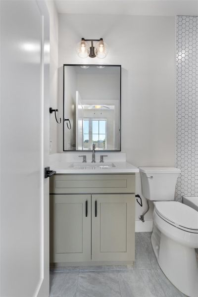 Full bathroom in secondary bedroom. Vanity with shaker-style cabinetry, white quartz countertop, and a rectangular undermount sink Full bathroom in secondary bedroom. Vanity with shaker-style cabinetry, white quartz countertop, and a rectangular undermount sink