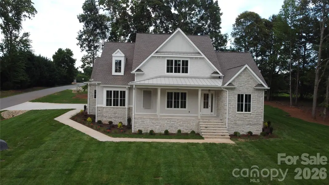 Front exterior of a new home in , Mooresville, NC, highlighting curb appeal (Image 4). Front exterior of a new home in , Mooresville, NC, highlighting curb appeal (Image 4).