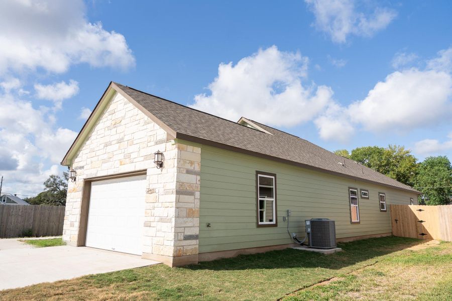 Front exterior of a new home in , Smithville, TX, highlighting curb appeal (Image 20).