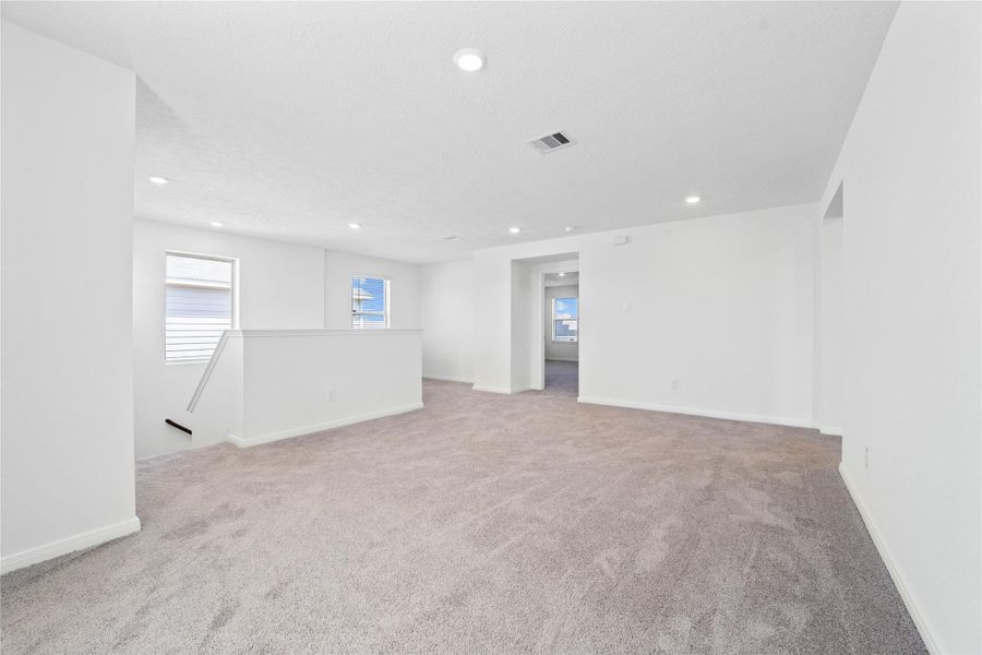 Additional view from game room looking into the primary bedroom. Additional view from game room looking into the primary bedroom.