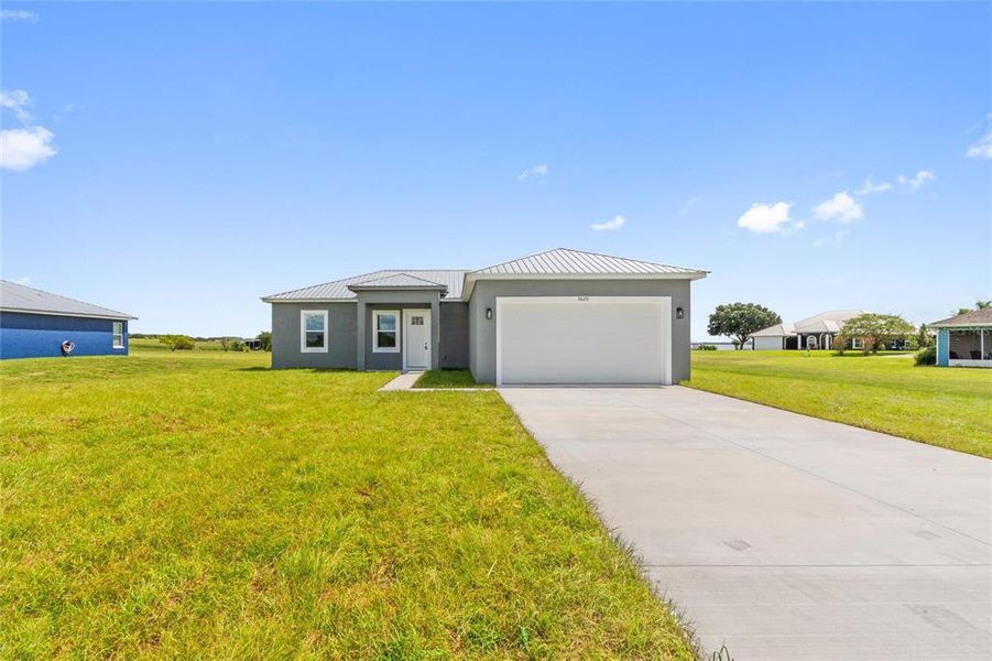 Front exterior of a new home in , Fort Meade, FL, highlighting curb appeal (Image 1). Front exterior of a new home in , Fort Meade, FL, highlighting curb appeal (Image 1).