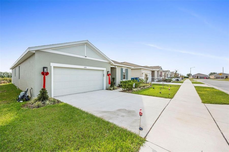 Front exterior of a new home in , Lake Wales, FL, highlighting curb appeal (Image 28). Front exterior of a new home in , Lake Wales, FL, highlighting curb appeal (Image 28).