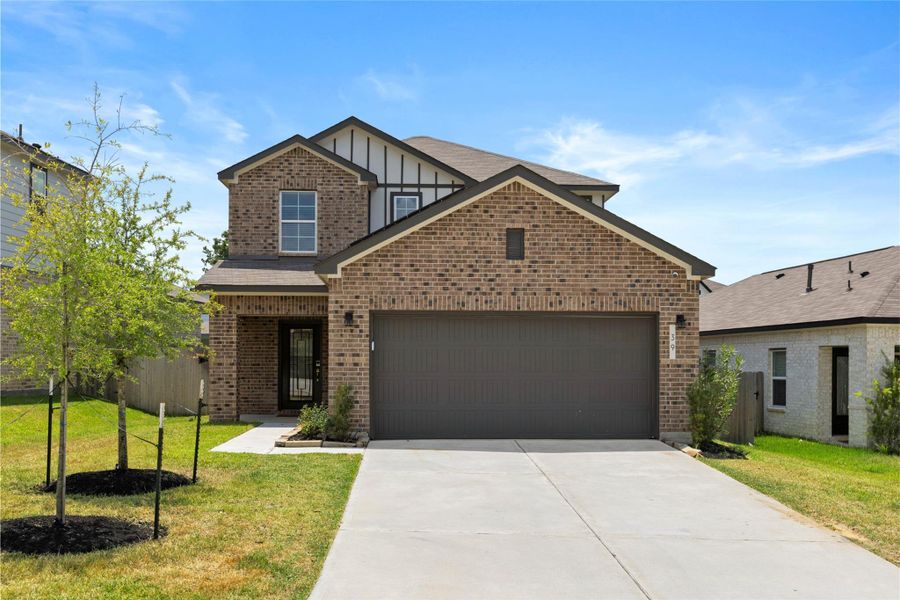 Front exterior of a new home in Lakes at Black Oak, Magnolia, TX, highlighting curb appeal (Image 25).