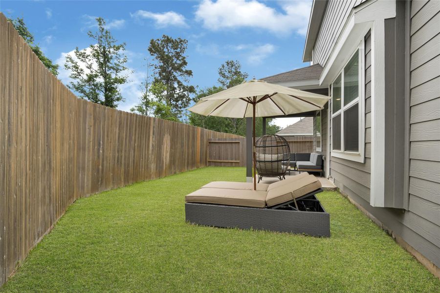 Exterior details and patio area of a home in River's Edge, Conroe (Image 4).